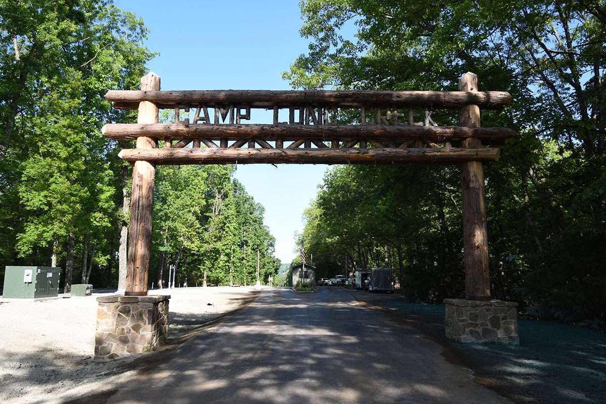 A log entry gate over the drive into Camp Long Creek